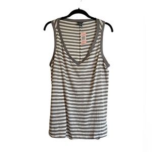 Cute never been worn sleeveless top with a cute slit in back!